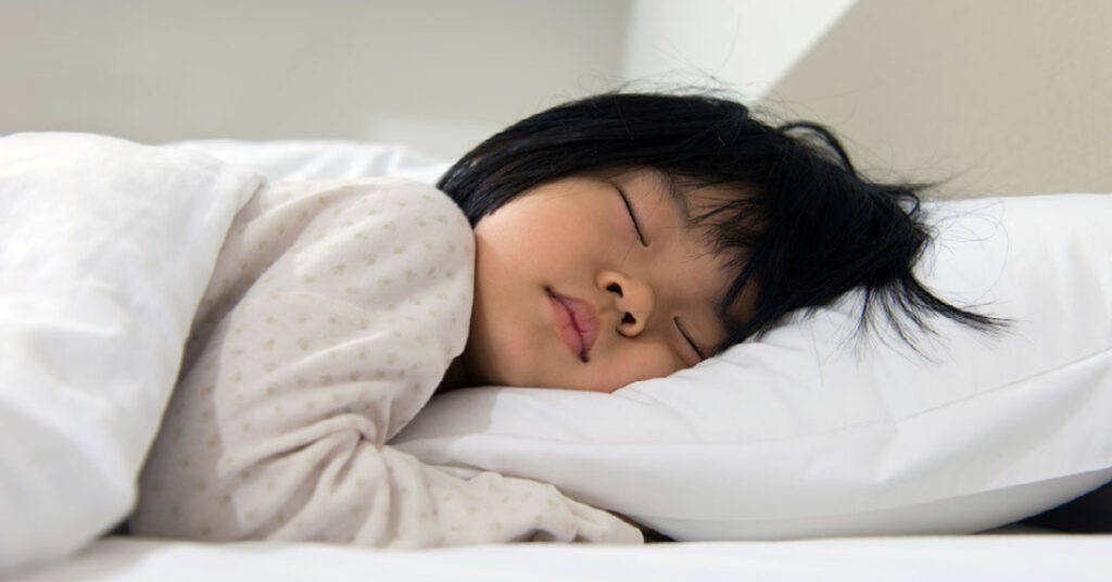 Toddler Sleeping on a fluffy pillow